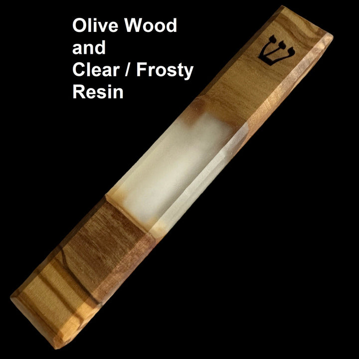 engraved handmade olive wood and clear frosty resin mezuzah on black background