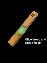 Load image into Gallery viewer, Engraved handmade olive wood and green resin mezuzah on black background
