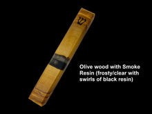Load image into Gallery viewer, Engraved handmade Olive wood and smoke Resin Mezuzah.  Smoke is frosty/clear with swirls of black resin.
