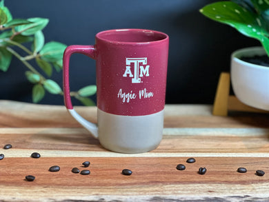 Burgundy with tan specks coffee tea mug with Texas A&M logo and Aggie Mom deep etched onto it