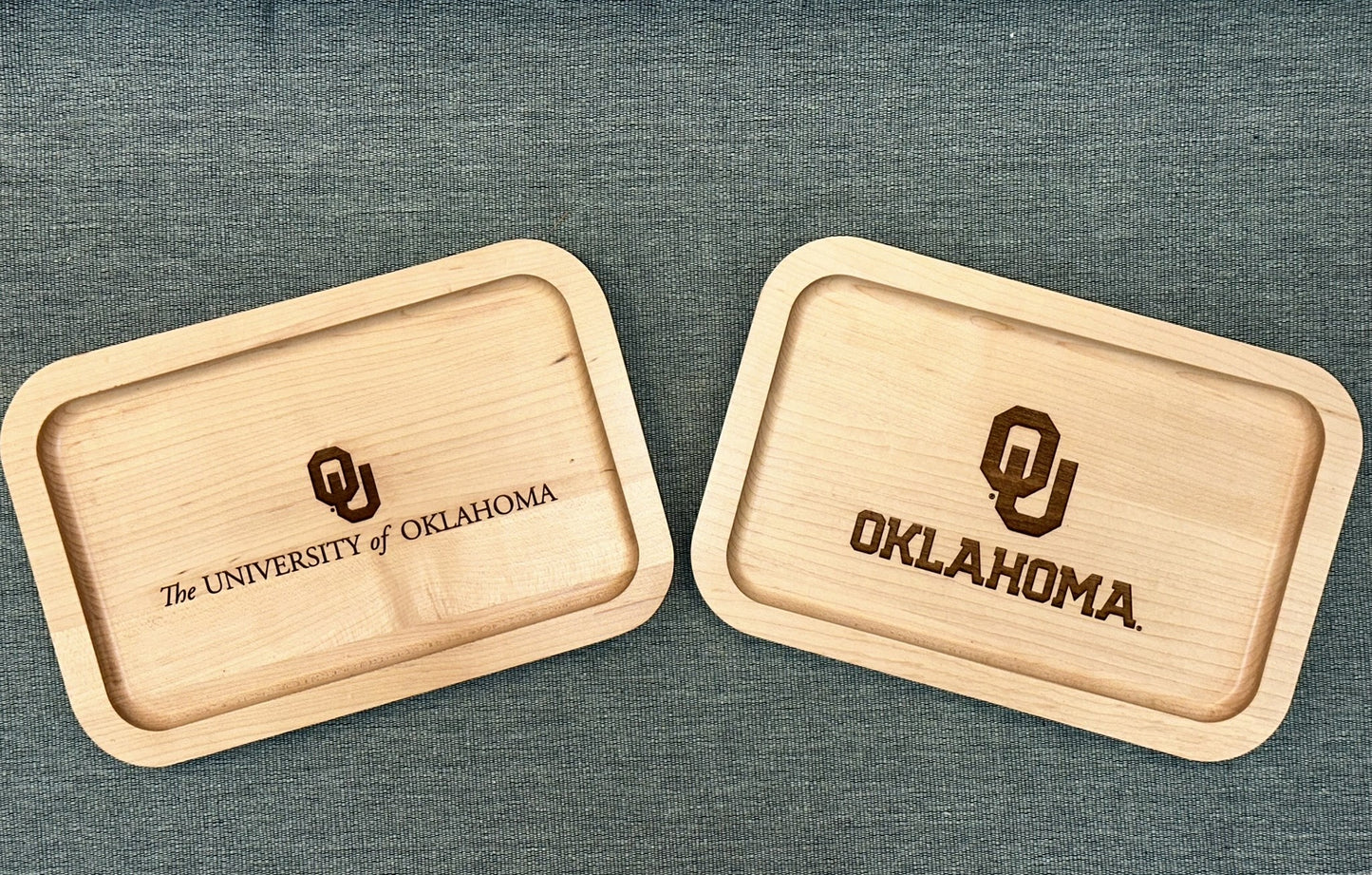 Two maple valet trays with the University of Oklahoma logos on them.