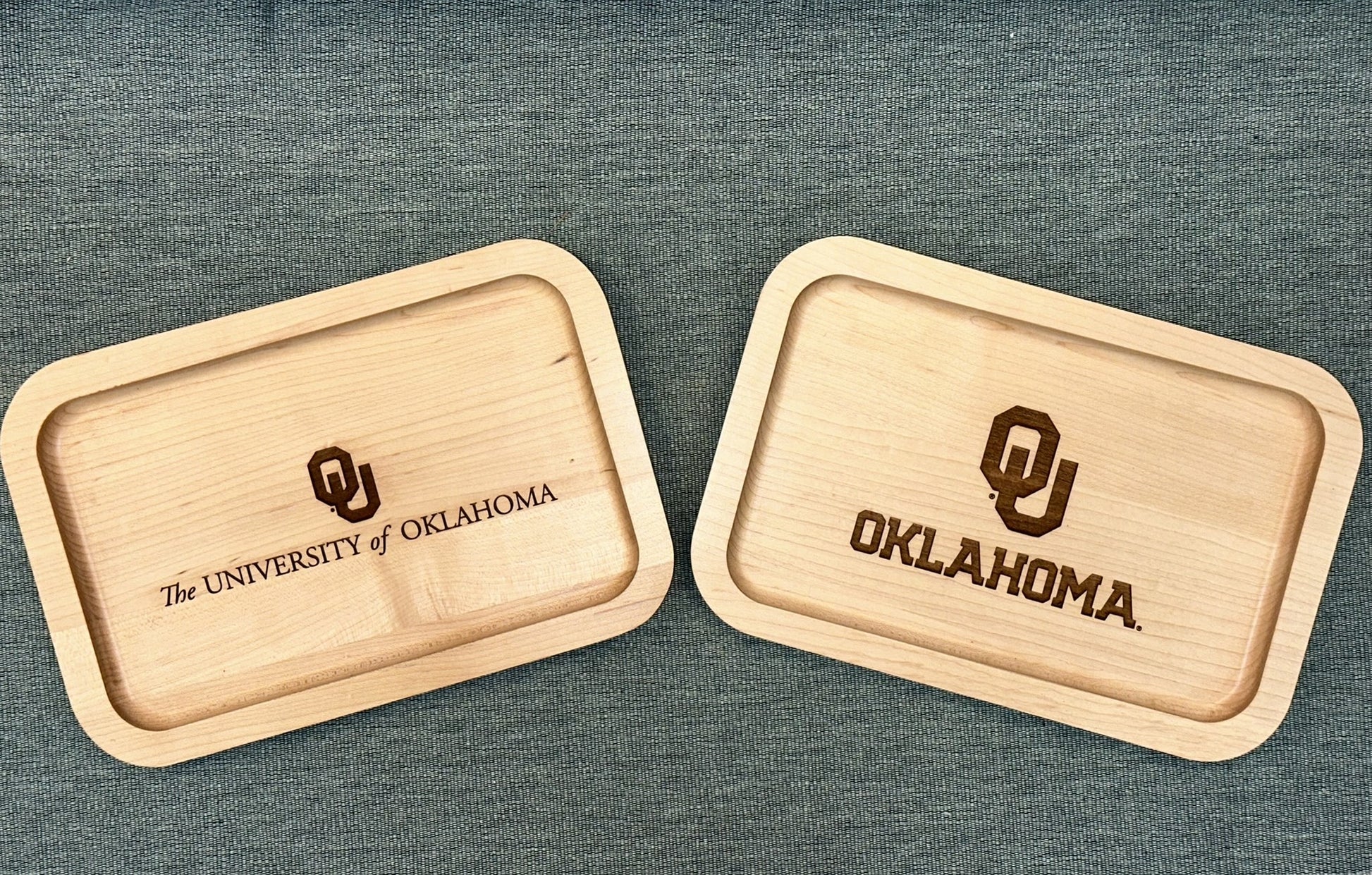 Two maple valet trays with the University of Oklahoma logos on them.