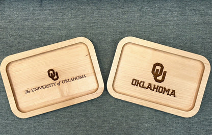 Two maple valet trays with the University of Oklahoma logos on them.