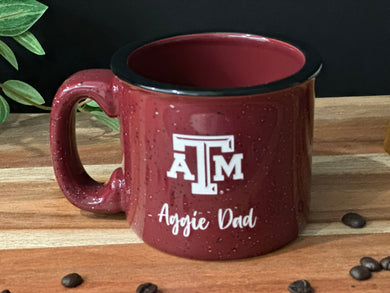 Maroon with white specs and black specs camping mug, with Texas A&M Logo and Aggie Dad deep etched onto the stoneware mug