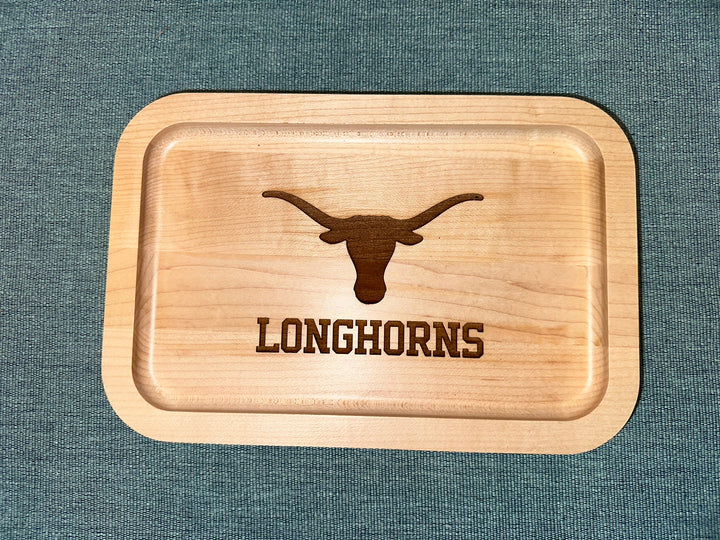 University of Texas at Austin Maple Wood Ring Tray with Outline of a Texas Longhorn skull laying on black surface
