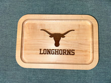 Load image into Gallery viewer, University of Texas at Austin Maple Wood Ring Tray with Outline of a Texas Longhorn skull laying on black surface

