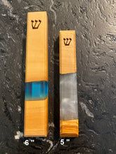 Load image into Gallery viewer, 6&quot; mezuzah and 5&quot; mezuzah lying side by side to show size differences
